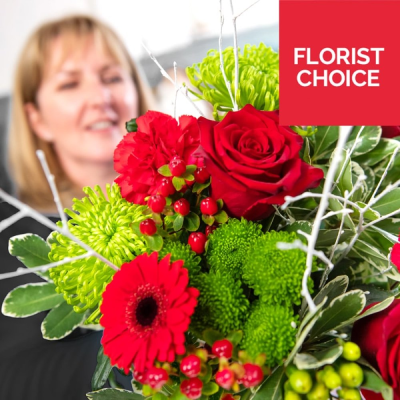 Christmas Florist Choice Flowers - Let the experts create a unique bouquet using the freshest festive beautiful blooms of the day, made especially for your loved one.